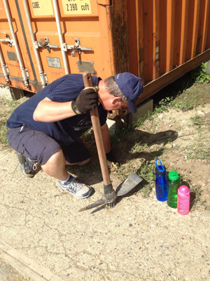 Dan digs a hole for the new fence